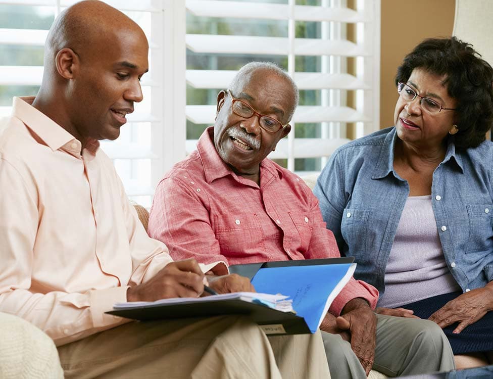Case worker helping seniors navigate their benefits.